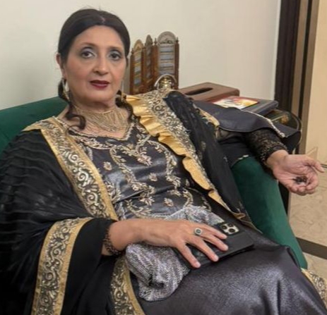 Sarwat Abdul Razzaq, gold industry expert, seated for a portrait